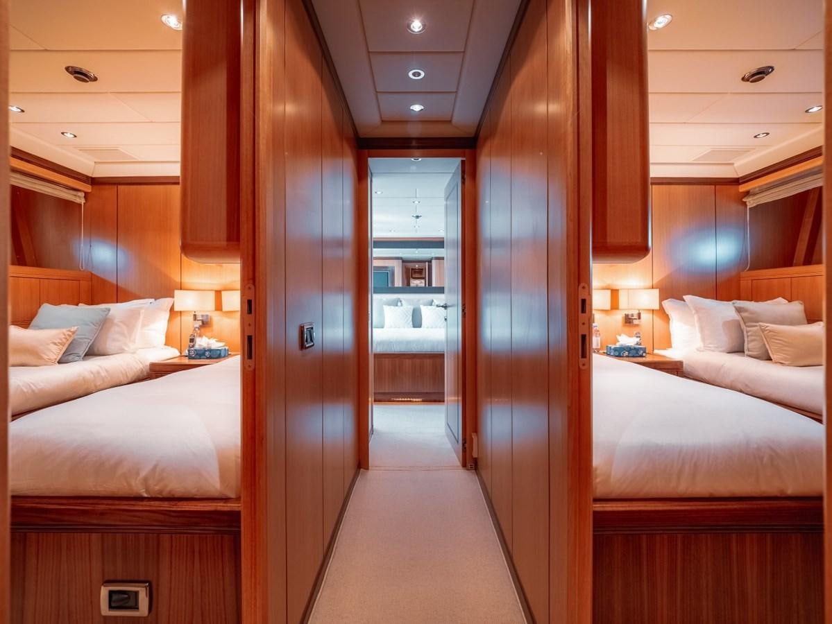a room with a bed and a closet aboard WET PANTHER Yacht for Sale
