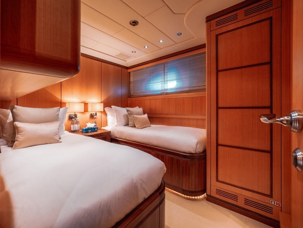 a room with a bed and a closet aboard WET PANTHER Yacht for Sale