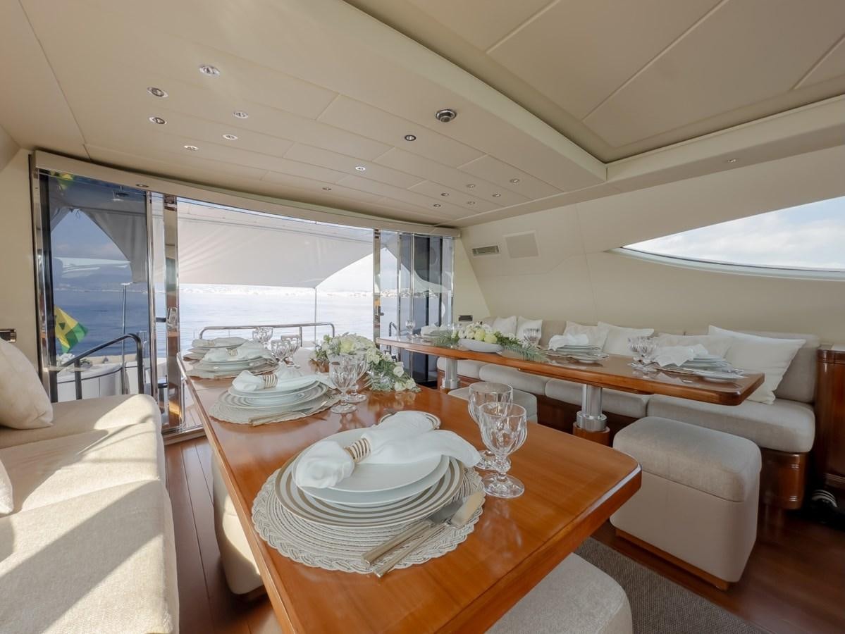 a dining room with a table and chairs aboard WET PANTHER Yacht for Sale
