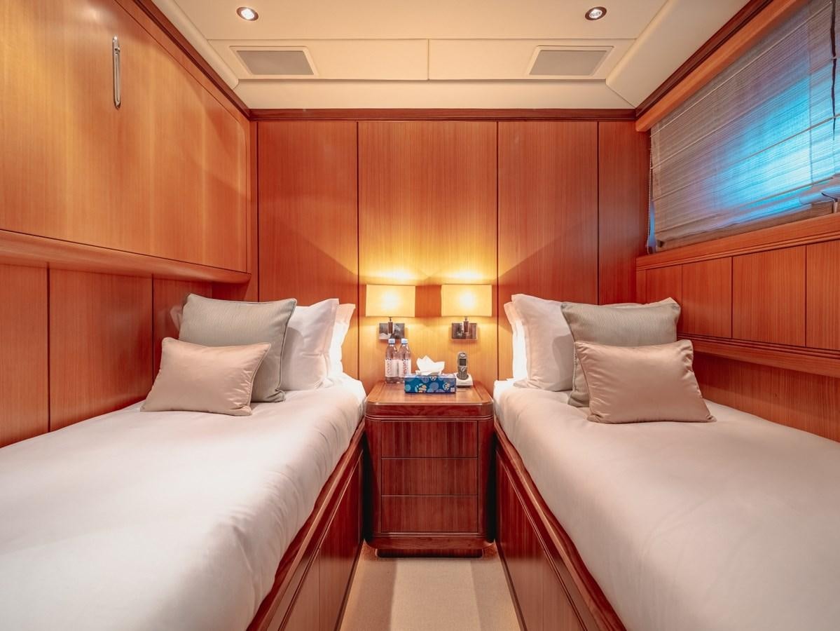 a room with two beds aboard WET PANTHER Yacht for Sale