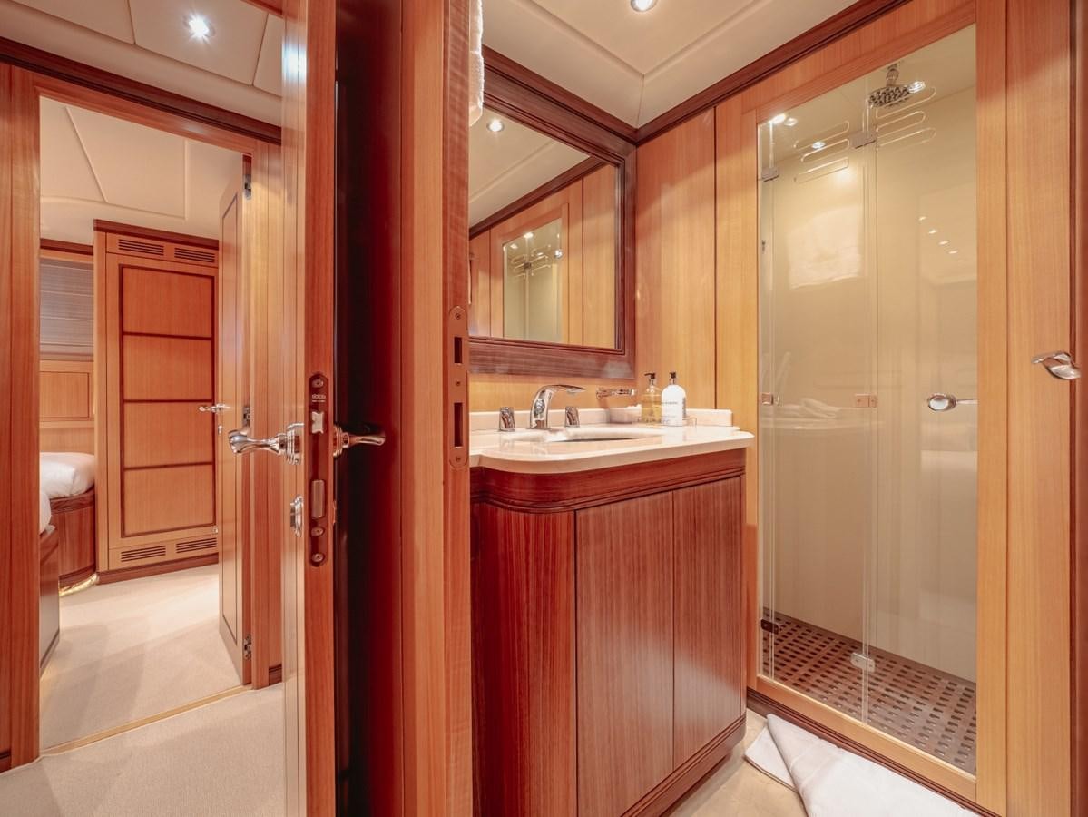 a bathroom with a sink and a mirror aboard WET PANTHER Yacht for Sale