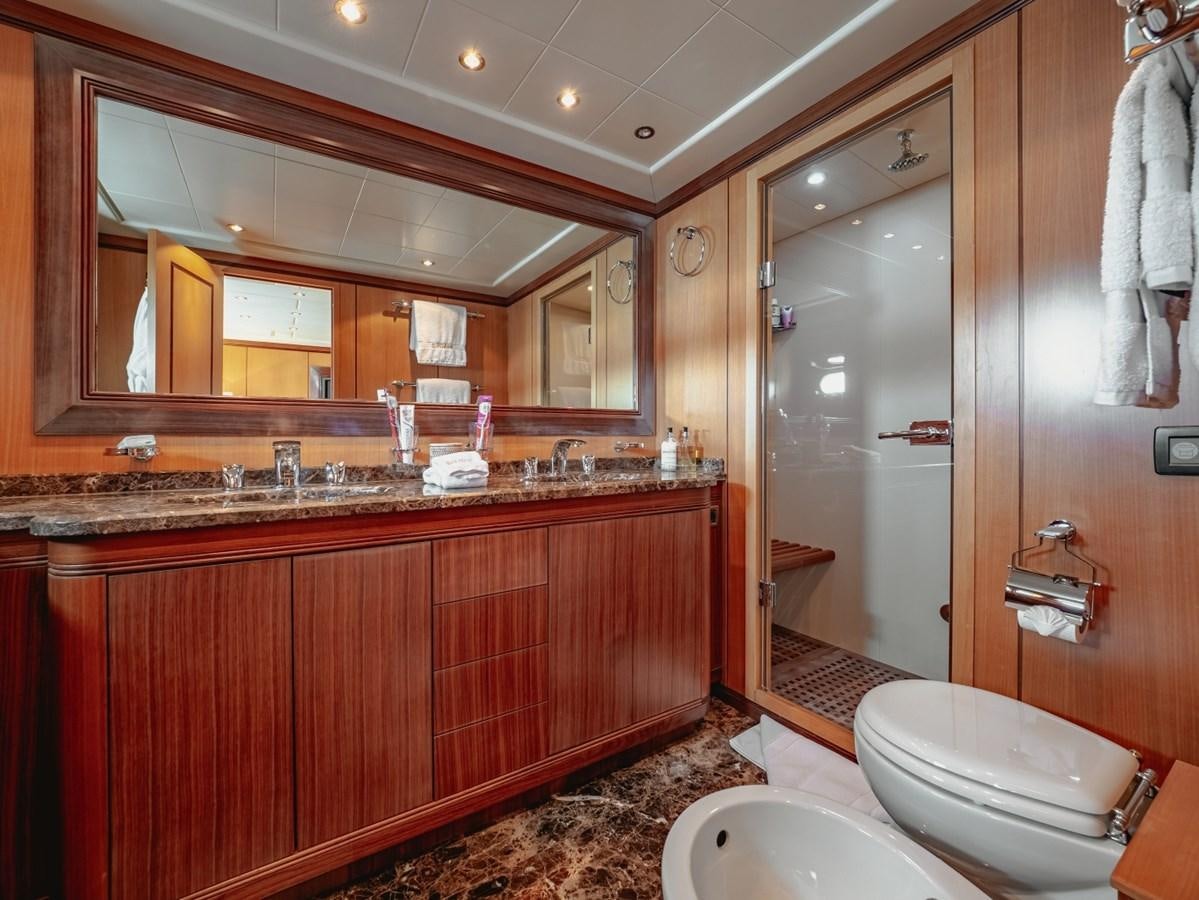 a bathroom with a large mirror aboard WET PANTHER Yacht for Sale