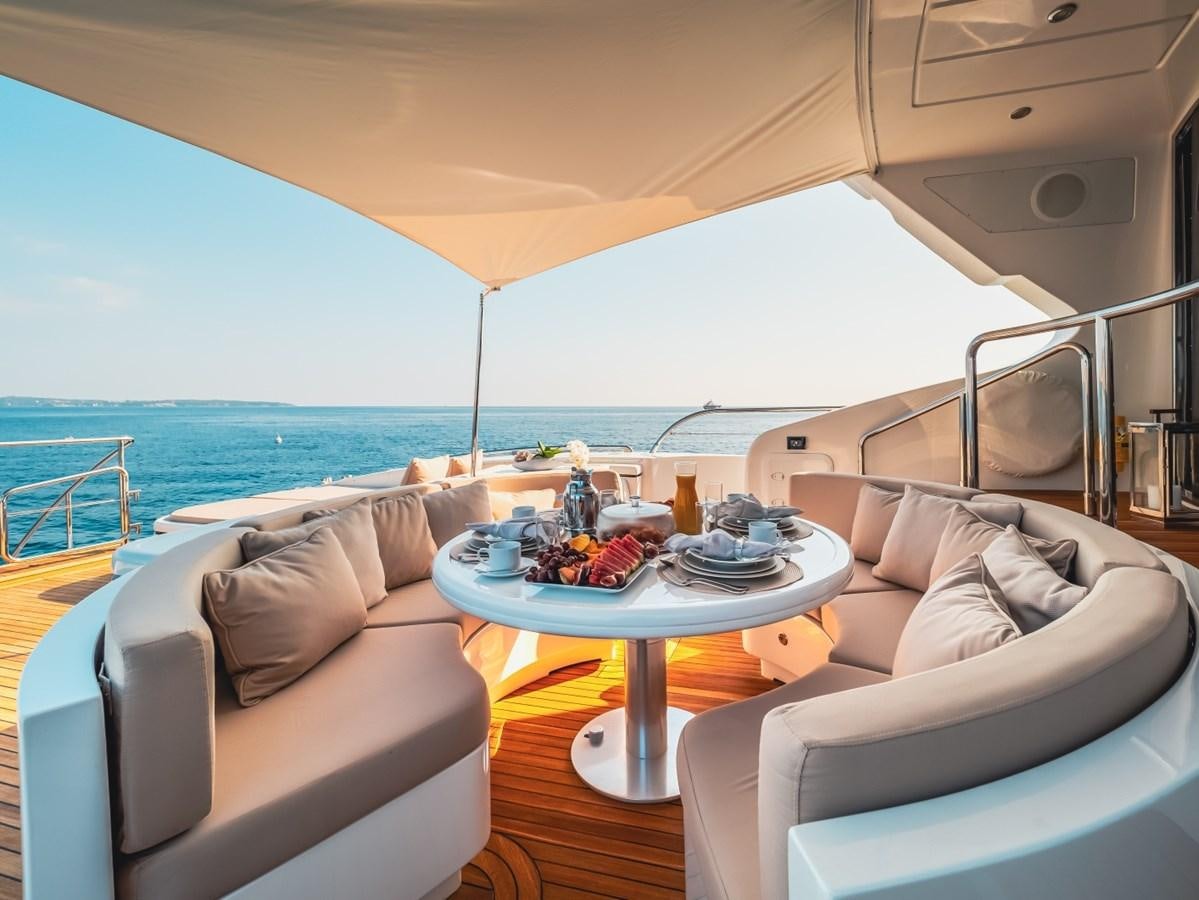a room with a table and chairs aboard WET PANTHER Yacht for Sale