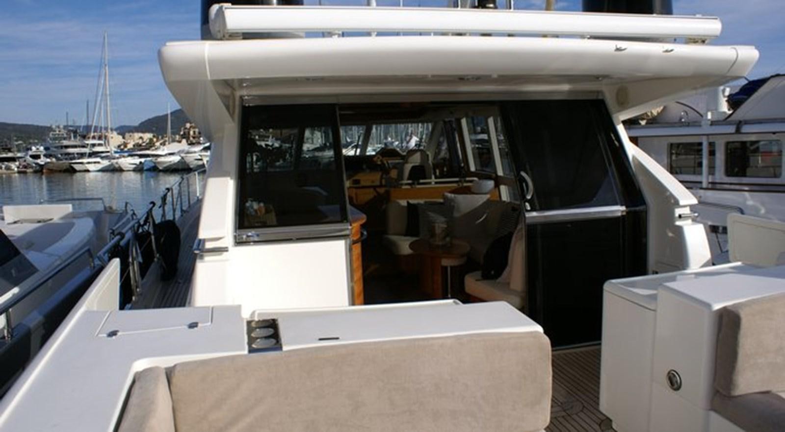 a boat with a table and chairs aboard WILD Yacht for Sale