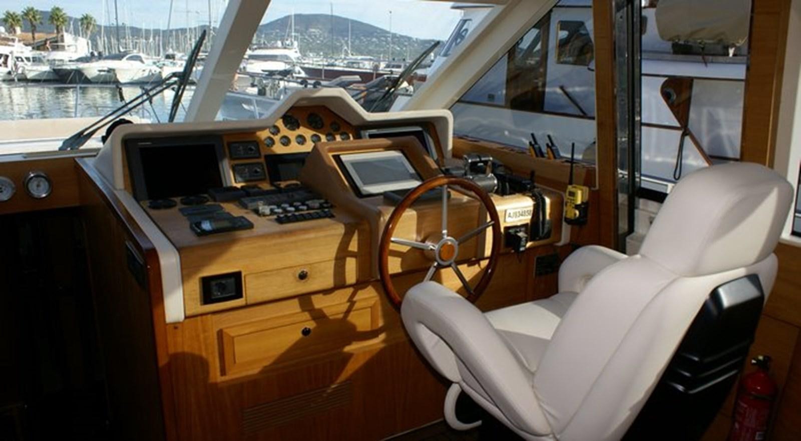 a room with a desk and a chair aboard WILD Yacht for Sale