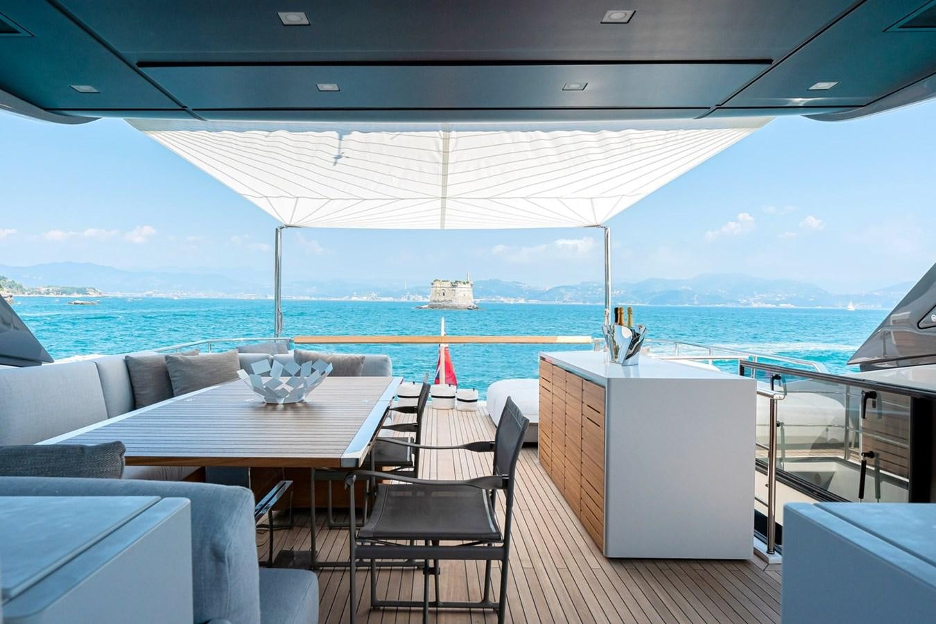 a deck with a view of the ocean and the ocean aboard #813 - SANLORENZO SL90A Yacht for Sale