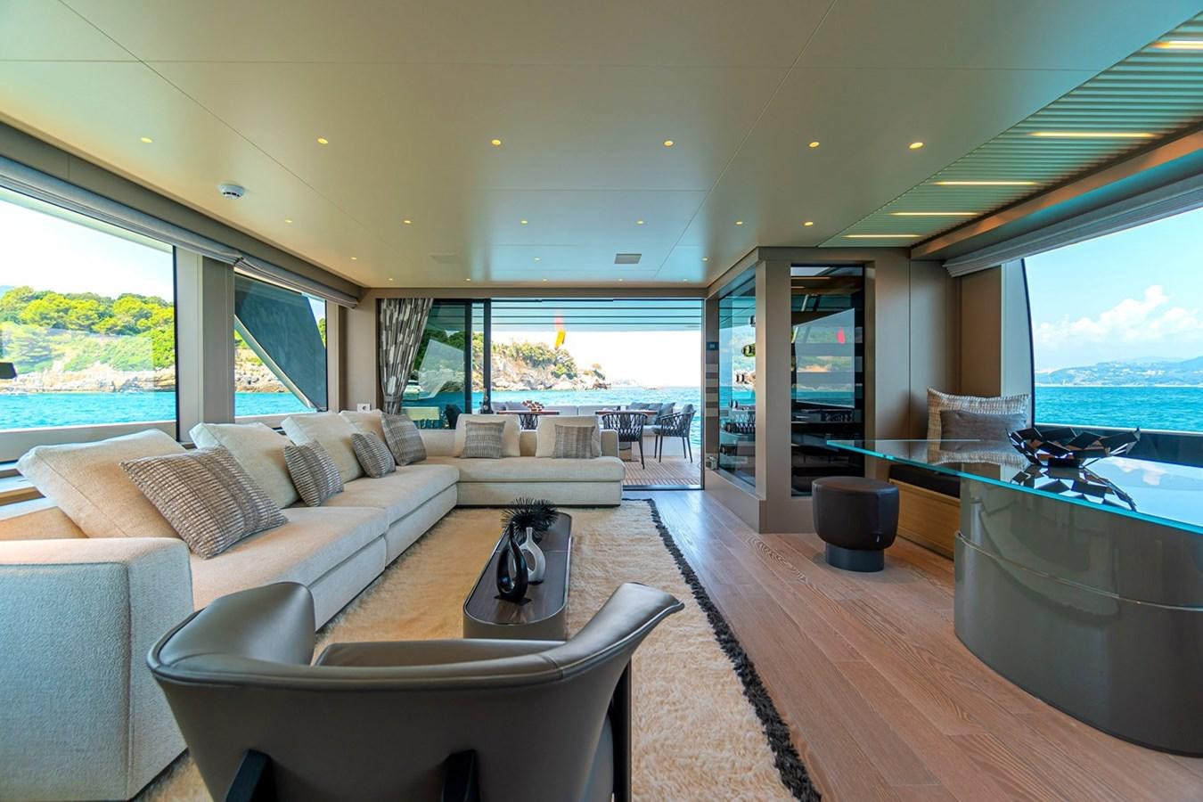 a living room with a large window aboard #813 - SANLORENZO SL90A Yacht for Sale