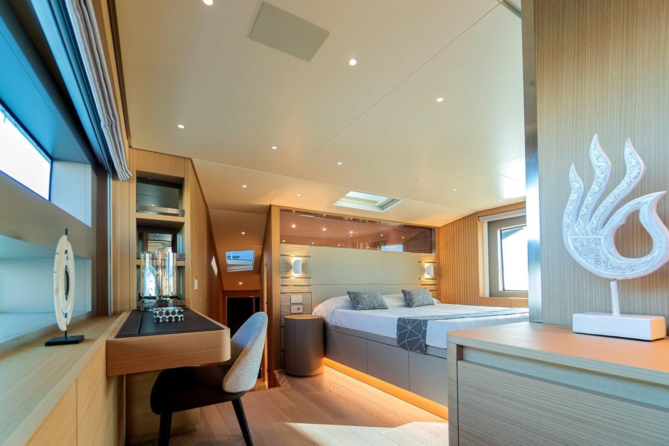 a room with a bed and a desk aboard #813 - SANLORENZO SL90A Yacht for Sale