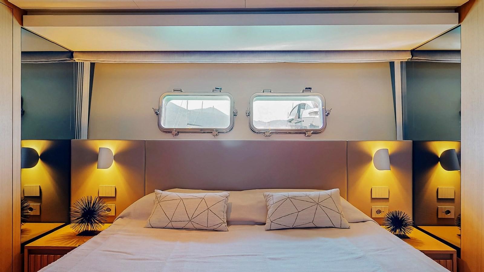 a bed with a white bed spread aboard #813 - SANLORENZO SL90A Yacht for Sale