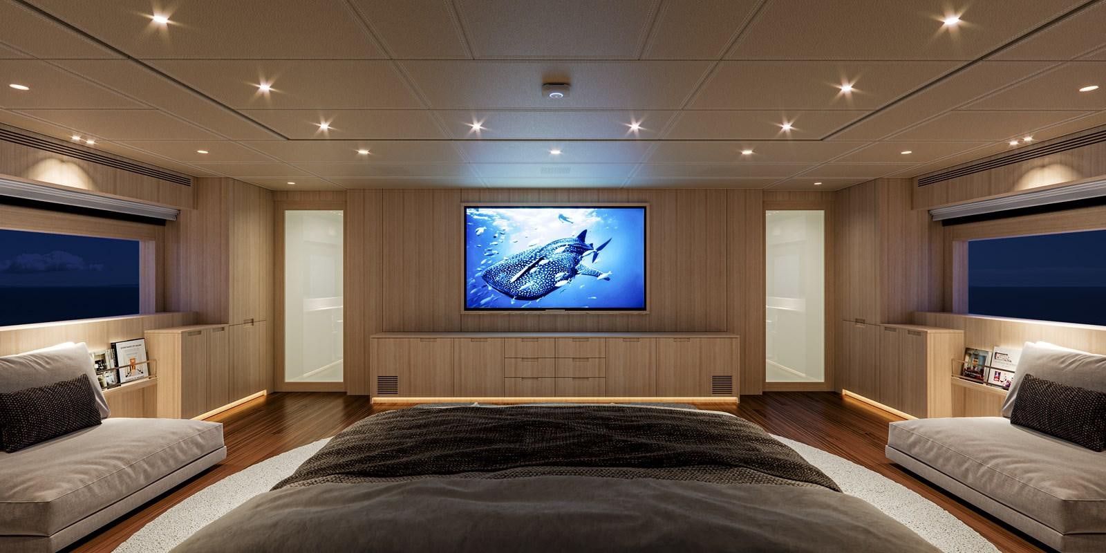 a large room with a tv on the wall aboard NO STRESS TWO Yacht for Sale