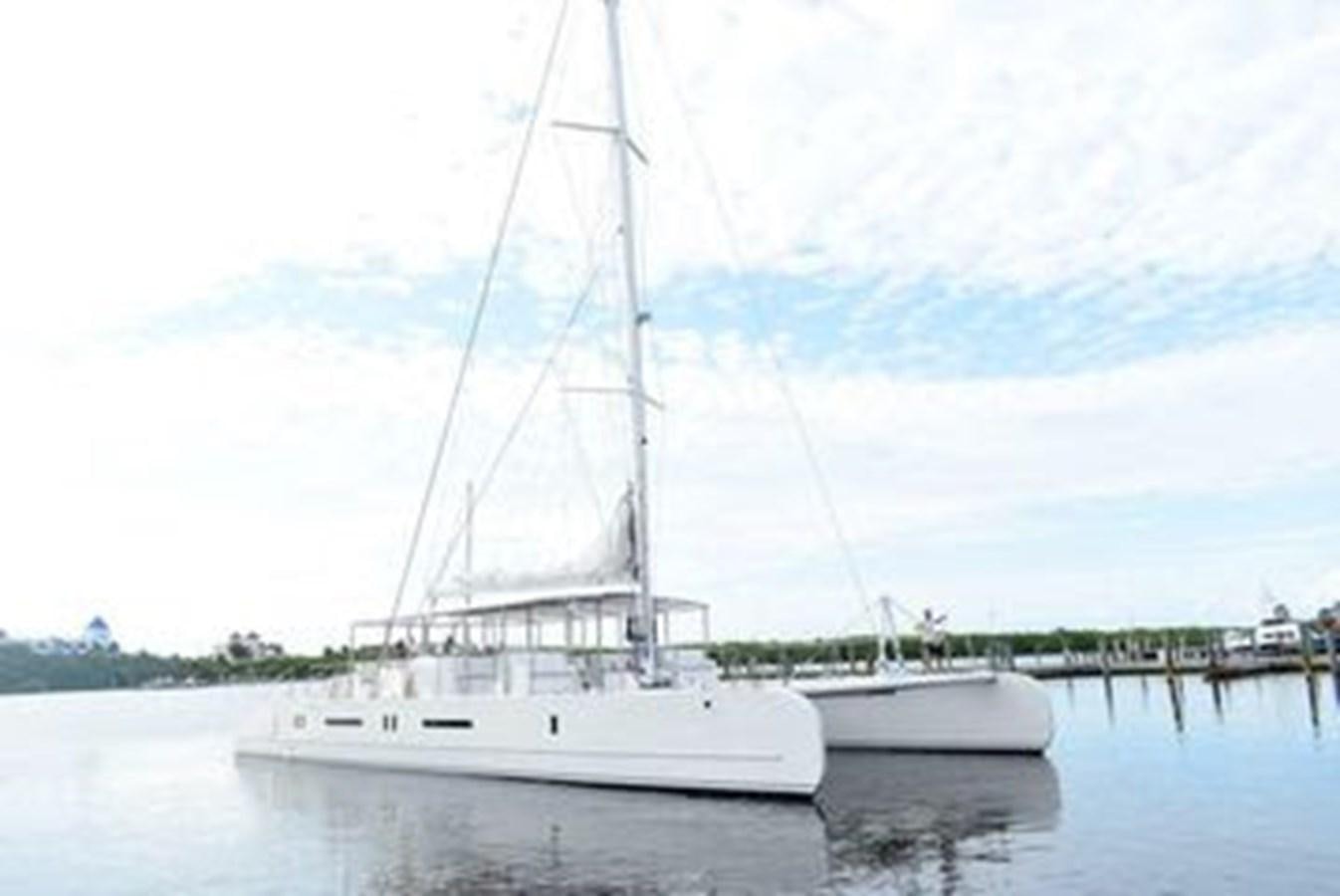 a large white boat in a harbor aboard 2020 COMPASS SEA COMPASS 82 Yacht for Sale