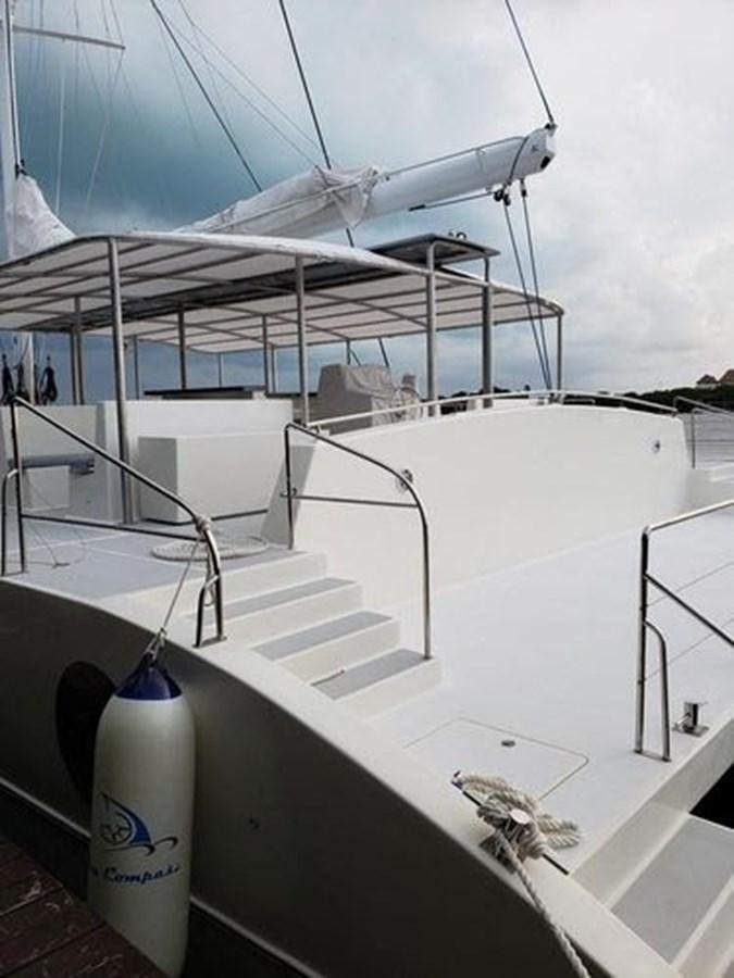 a white boat on a deck aboard 2020 COMPASS SEA COMPASS 82 Yacht for Sale