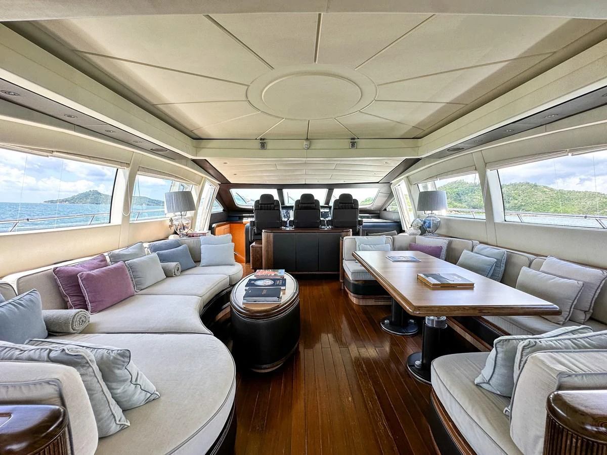 a large room with a couch and a table aboard BEAR MARKET Yacht for Sale