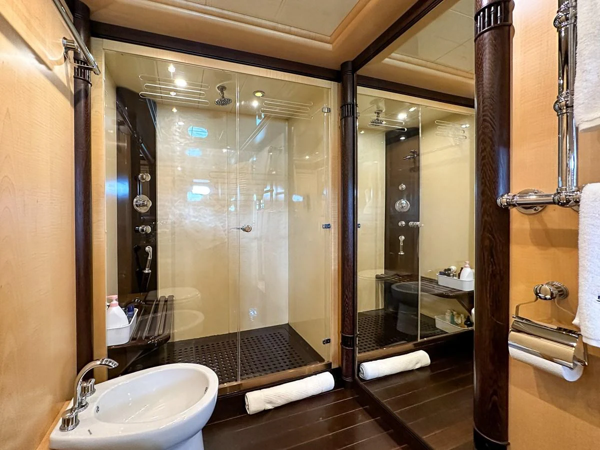 a bathroom with a glass shower aboard BEAR MARKET Yacht for Sale