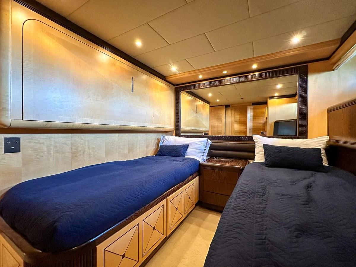 a room with two beds aboard BEAR MARKET Yacht for Sale