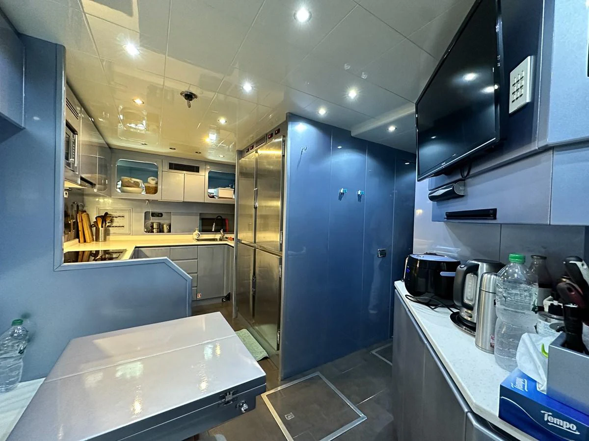 a kitchen with a lot of counter tops and cabinets aboard BEAR MARKET Yacht for Sale