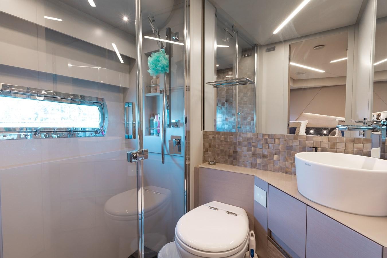 a bathroom with a glass shower aboard UNREEL Yacht for Sale