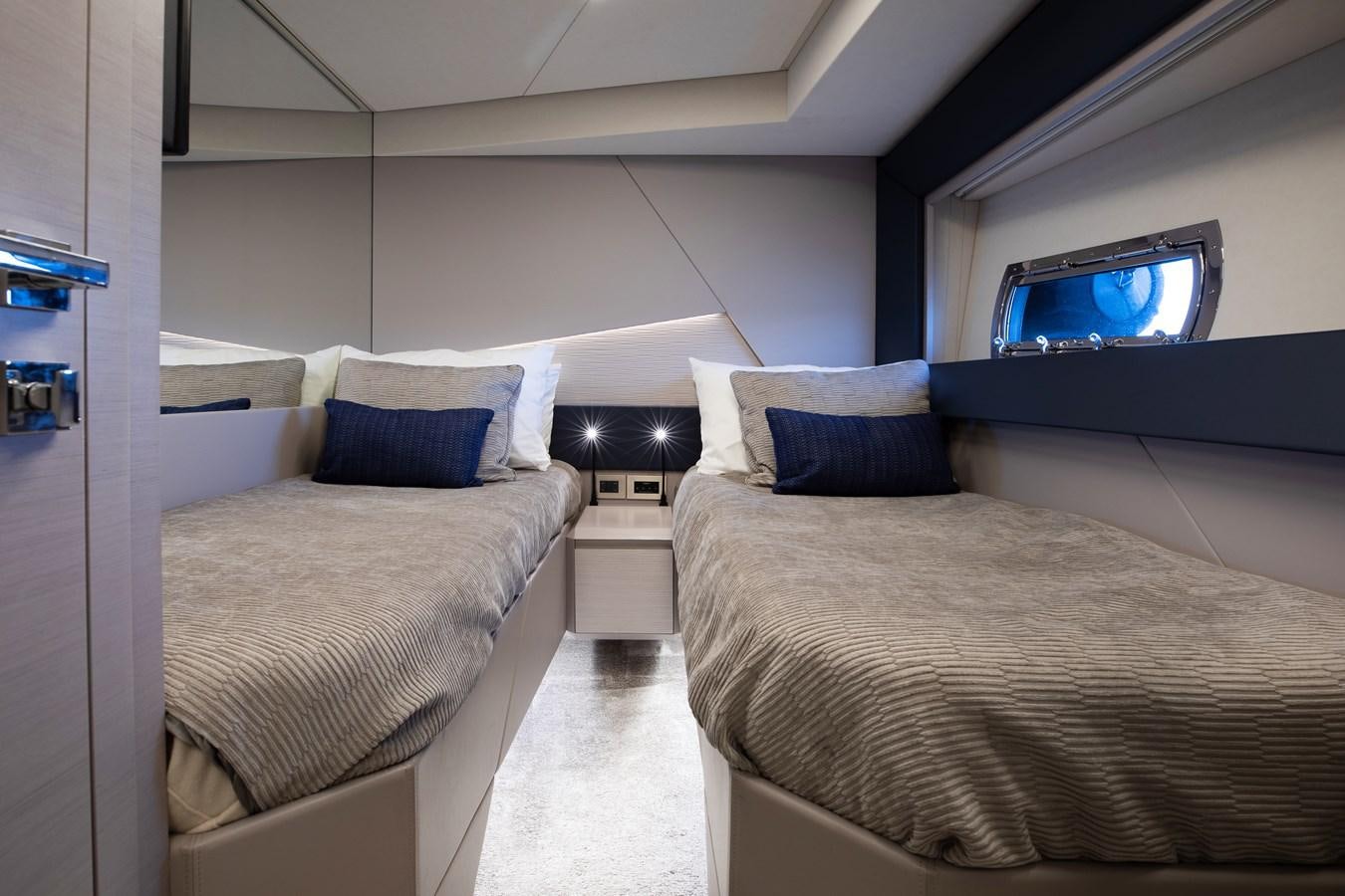 a room with two beds aboard UNREEL Yacht for Sale