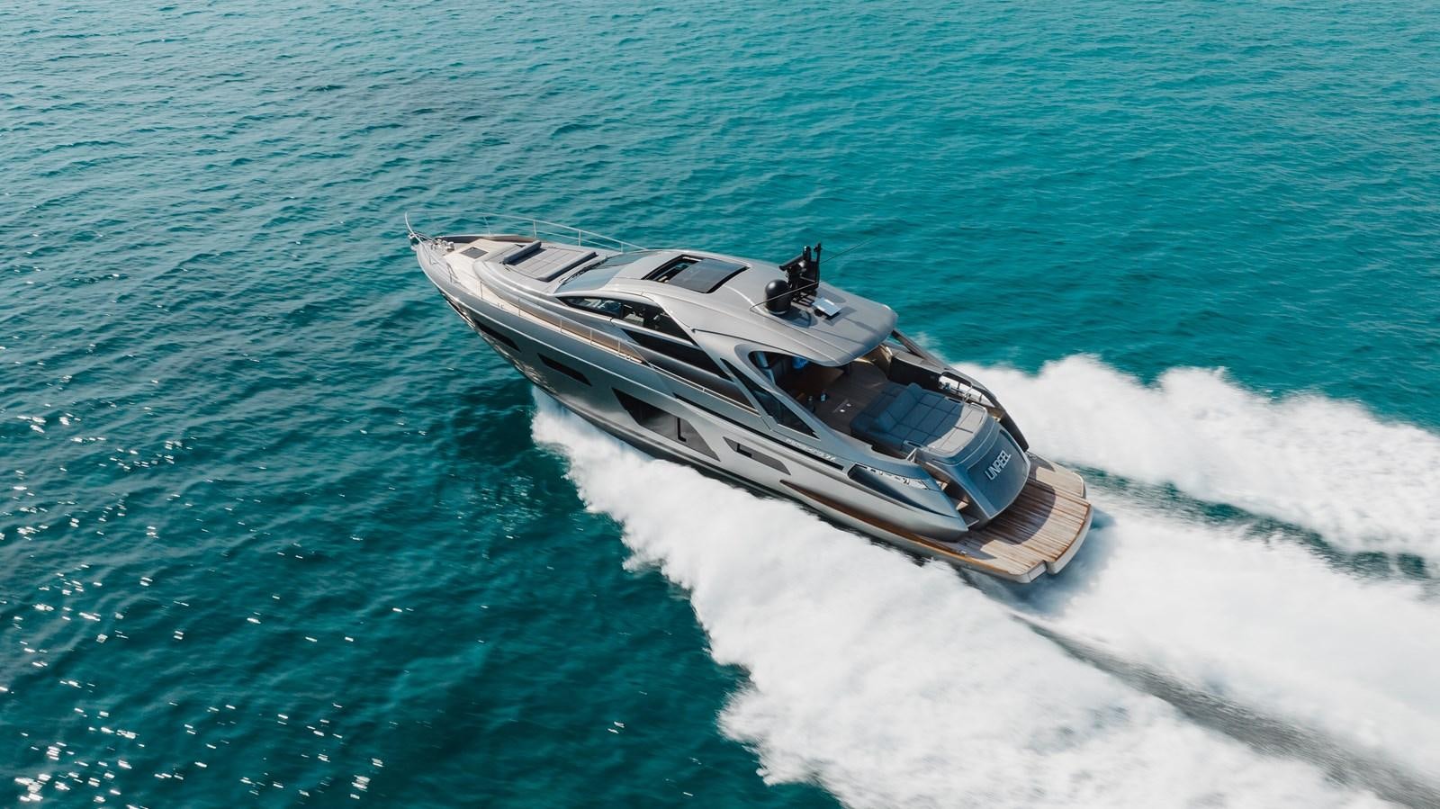 a helicopter flying over water aboard UNREEL Yacht for Sale