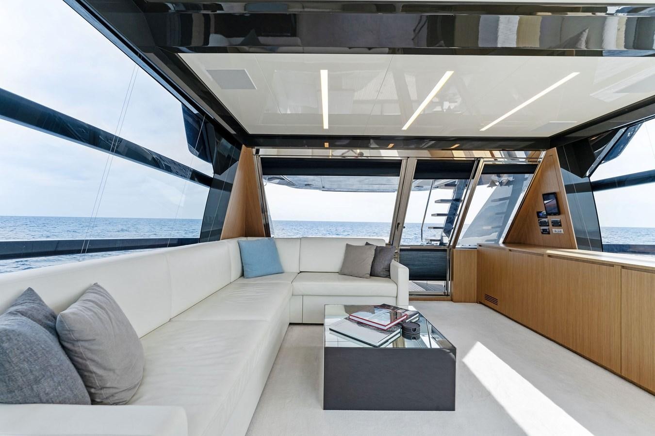 a room with a couch and a table aboard LADY LEENIE II Yacht for Sale