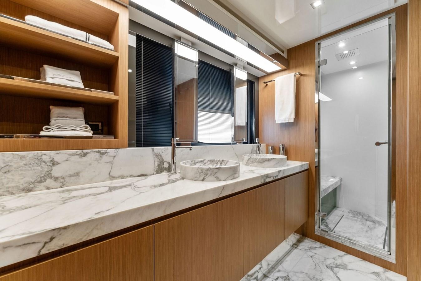 a bathroom with a sink and cabinets aboard LADY LEENIE II Yacht for Sale