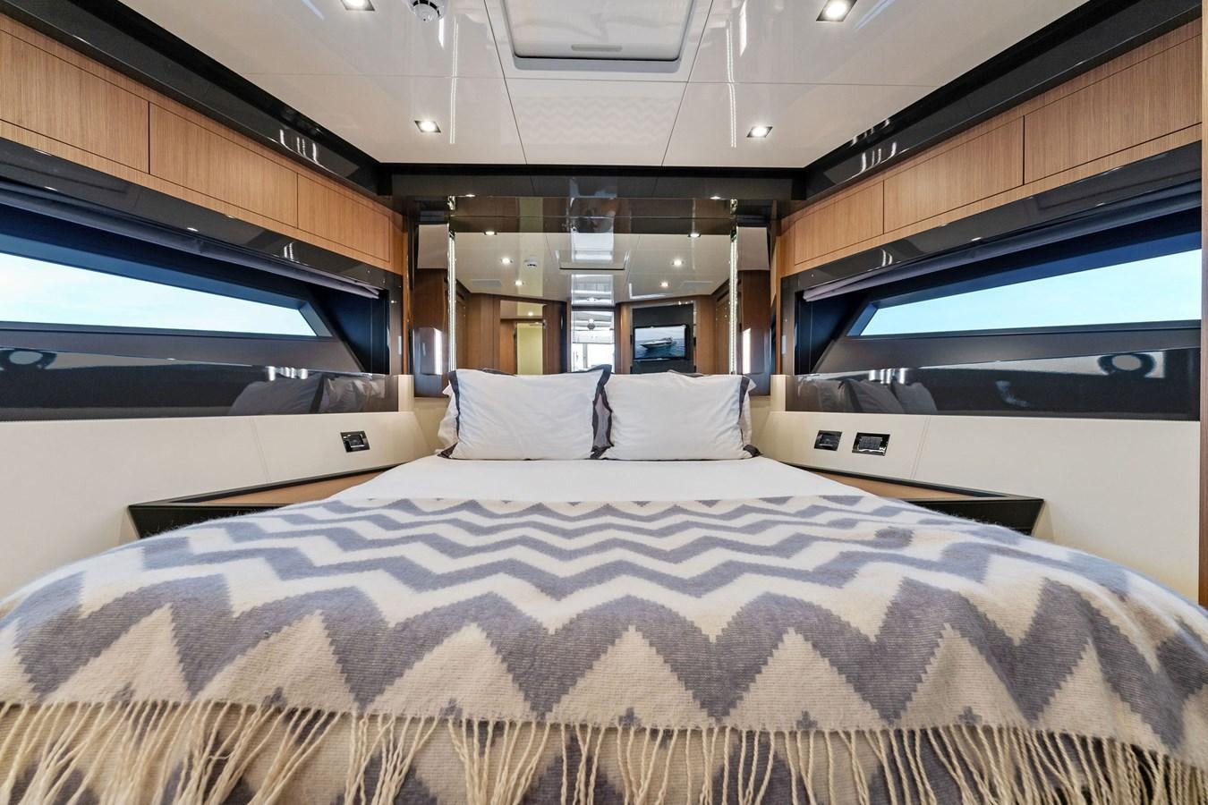 a bed in a room aboard LADY LEENIE II Yacht for Sale