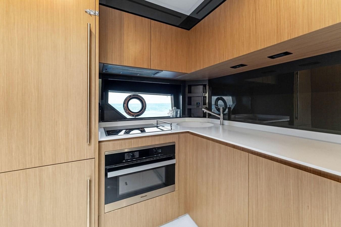 a microwave oven and microwave oven in a kitchen aboard LADY LEENIE II Yacht for Sale