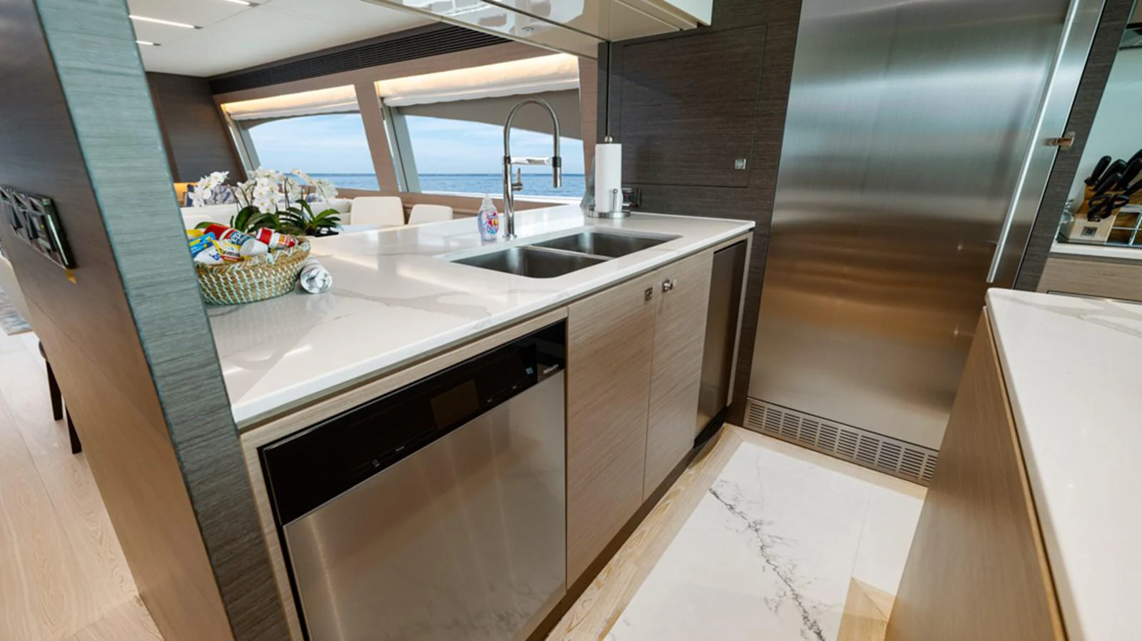 a kitchen with a sink and cabinets aboard 90 HORIZON Yacht for Sale