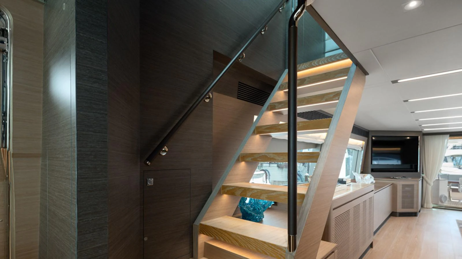 a wooden staircase in a house aboard 90 HORIZON Yacht for Sale