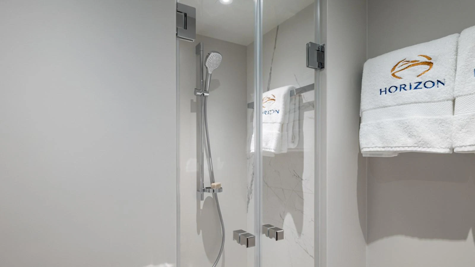 a shower unit with a towel on the wall aboard 90 HORIZON Yacht for Sale