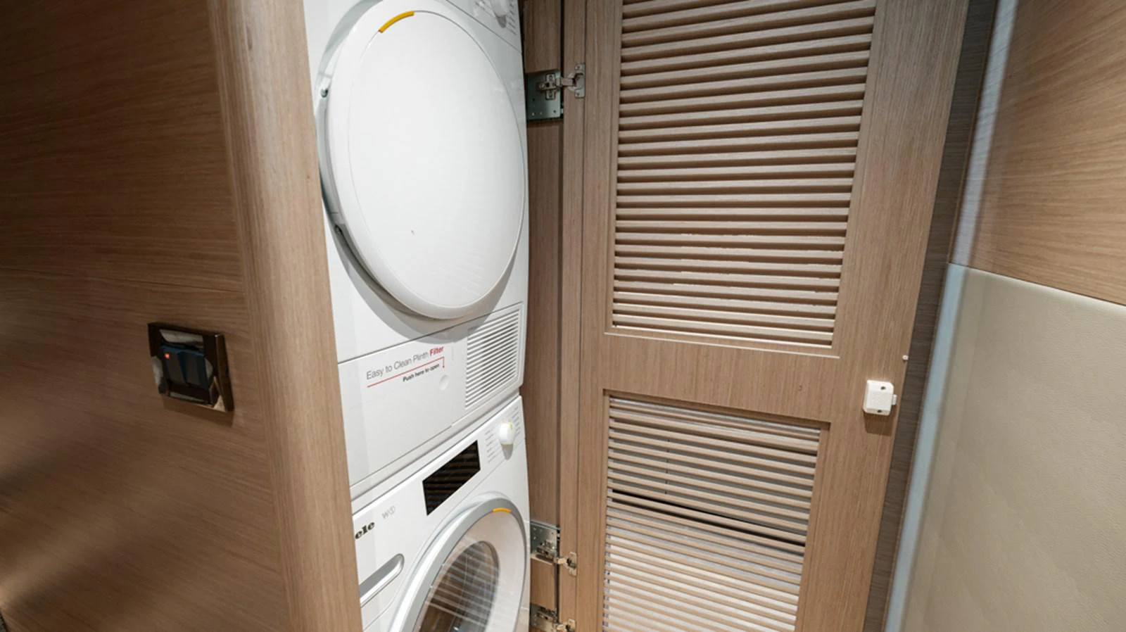 a white fan in a room aboard 90 HORIZON Yacht for Sale