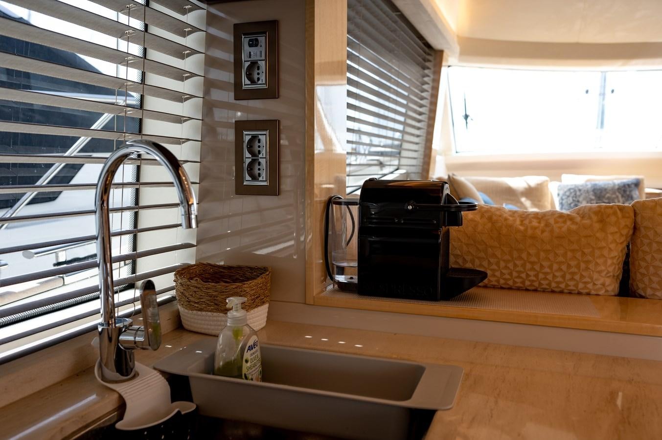 a kitchen with a sink and a microwave aboard FIVE WEEKS Yacht for Sale