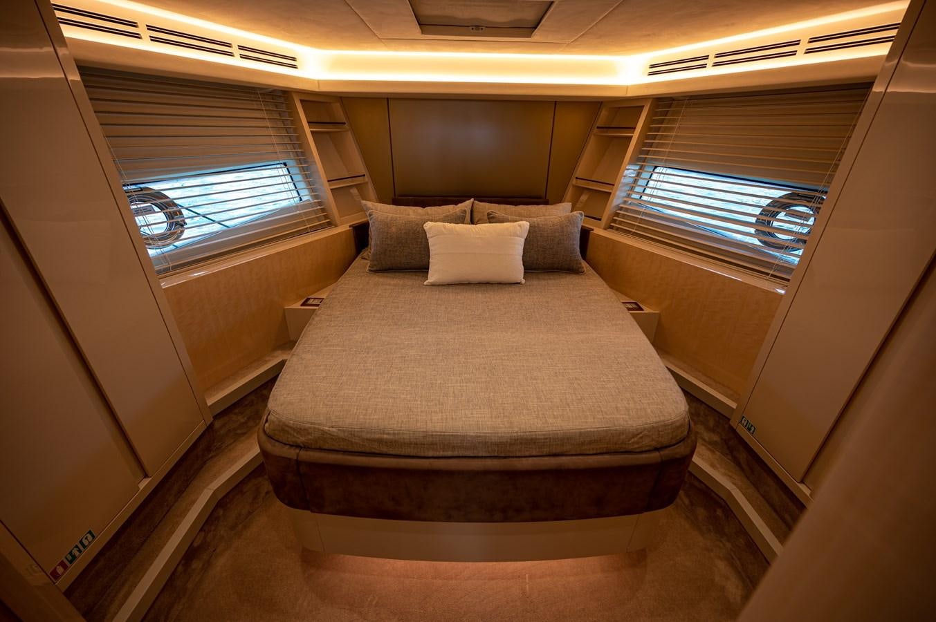 a bed in a room aboard FIVE WEEKS Yacht for Sale