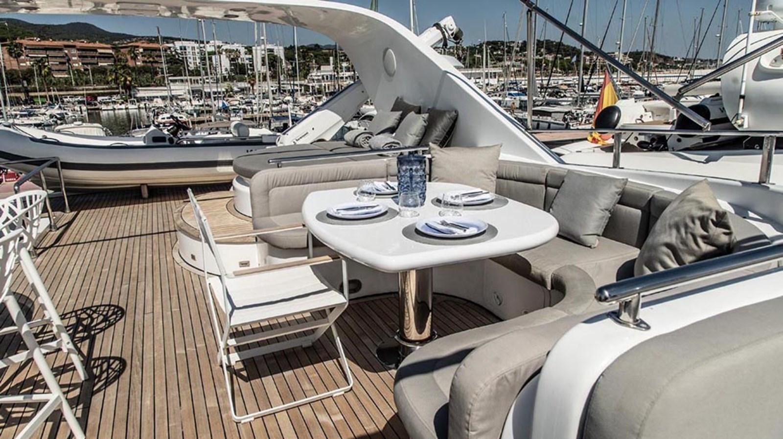 a table on a deck aboard SEVEN YOU Yacht for Sale