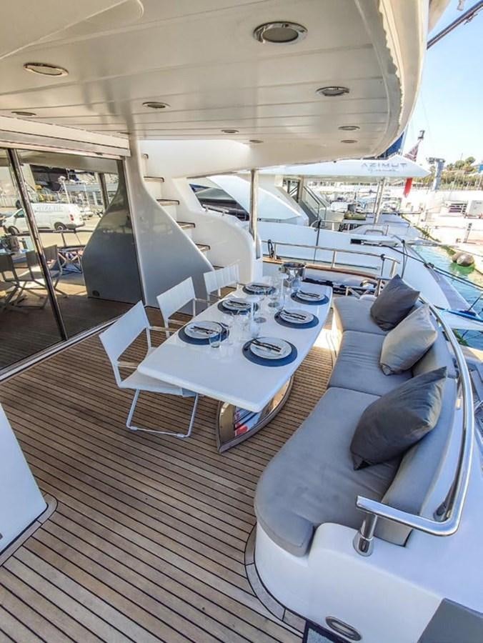 a boat with a table and chairs aboard SEVEN YOU Yacht for Sale