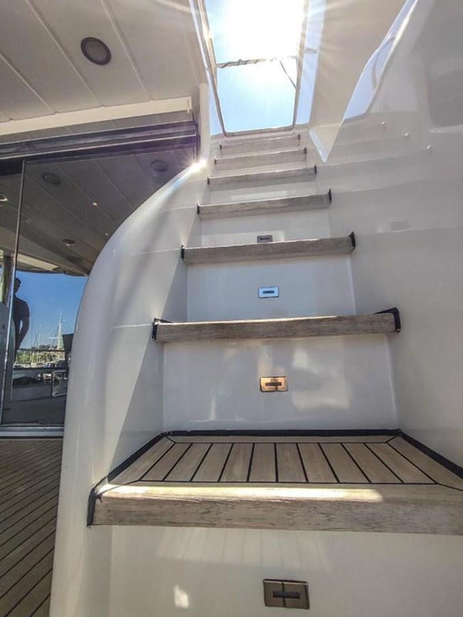 a staircase with a metal railing aboard SEVEN YOU Yacht for Sale