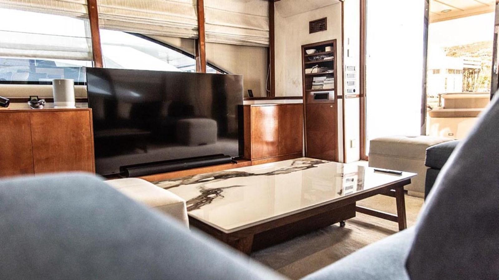 a living room with a fireplace aboard SEVEN YOU Yacht for Sale