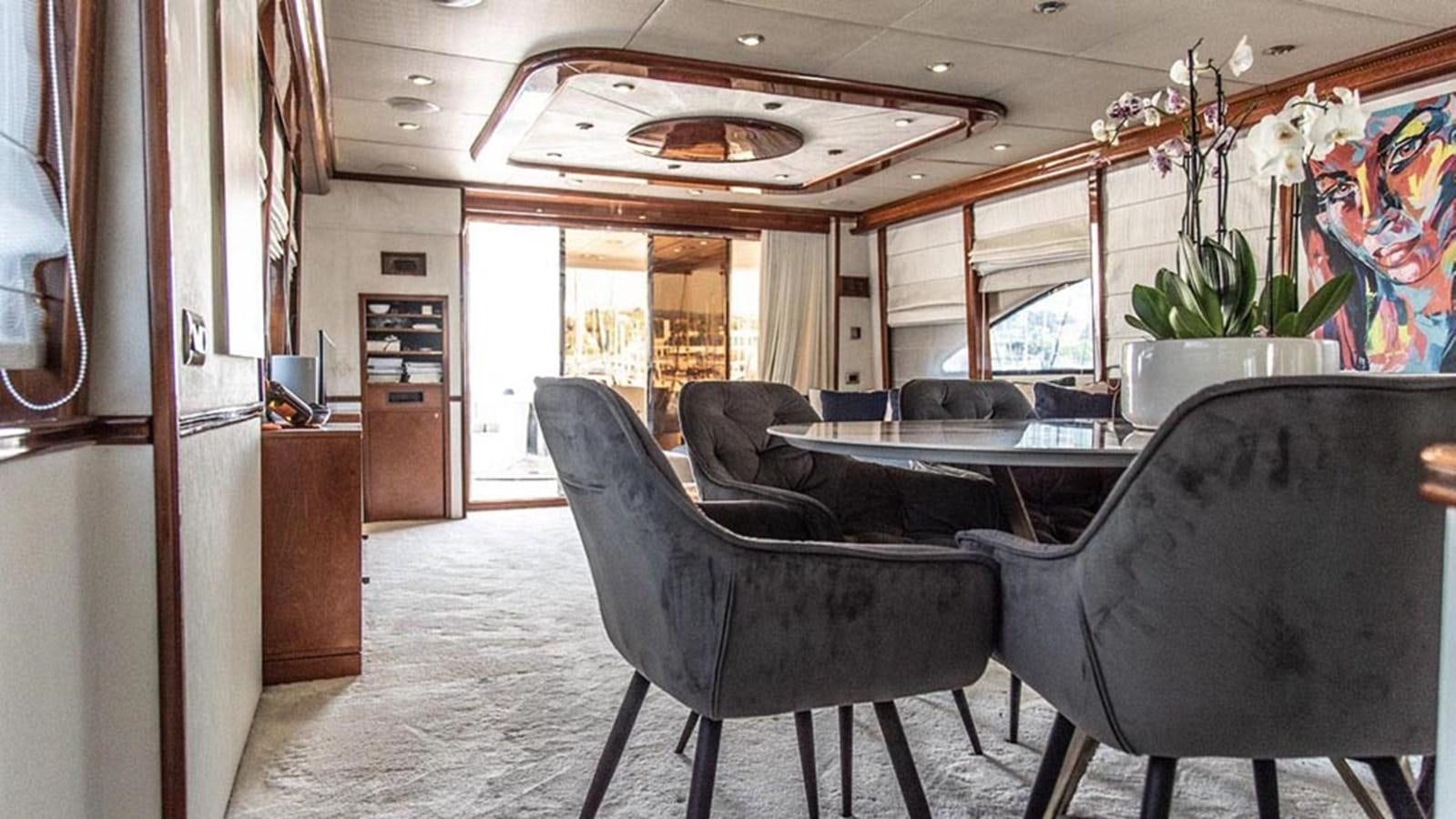 a room with a couch and a table aboard SEVEN YOU Yacht for Sale