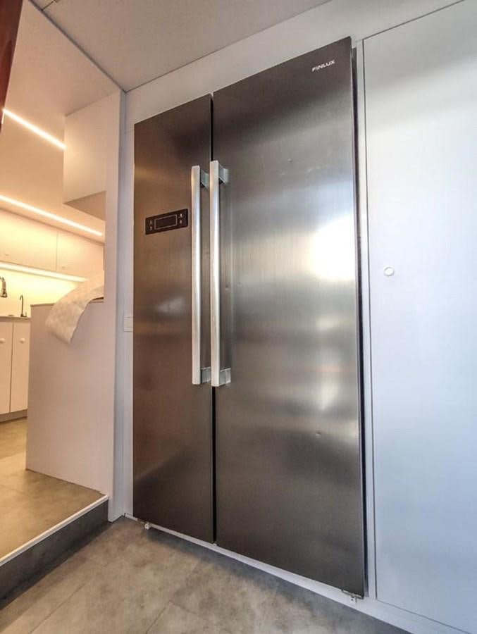 a stainless steel refrigerator aboard SEVEN YOU Yacht for Sale