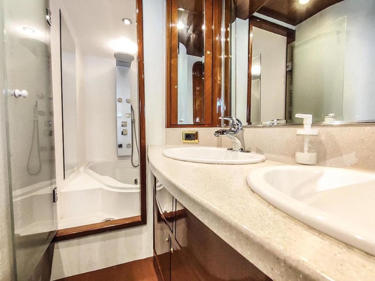 a bathroom with a sink and a mirror aboard SEVEN YOU Yacht for Sale