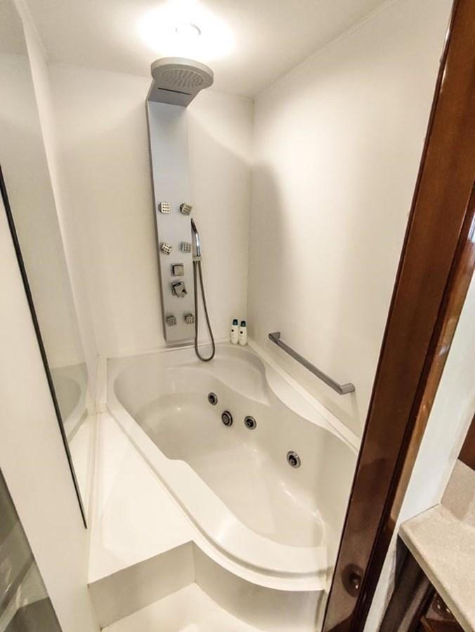 a bathroom with a bathtub aboard SEVEN YOU Yacht for Sale