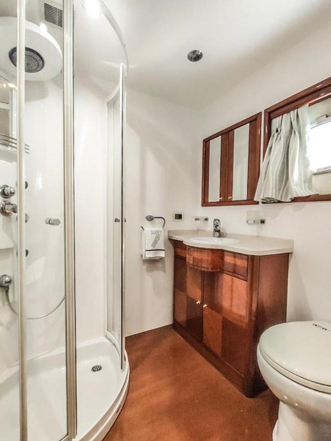 a bathroom with a shower unit and sink aboard SEVEN YOU Yacht for Sale