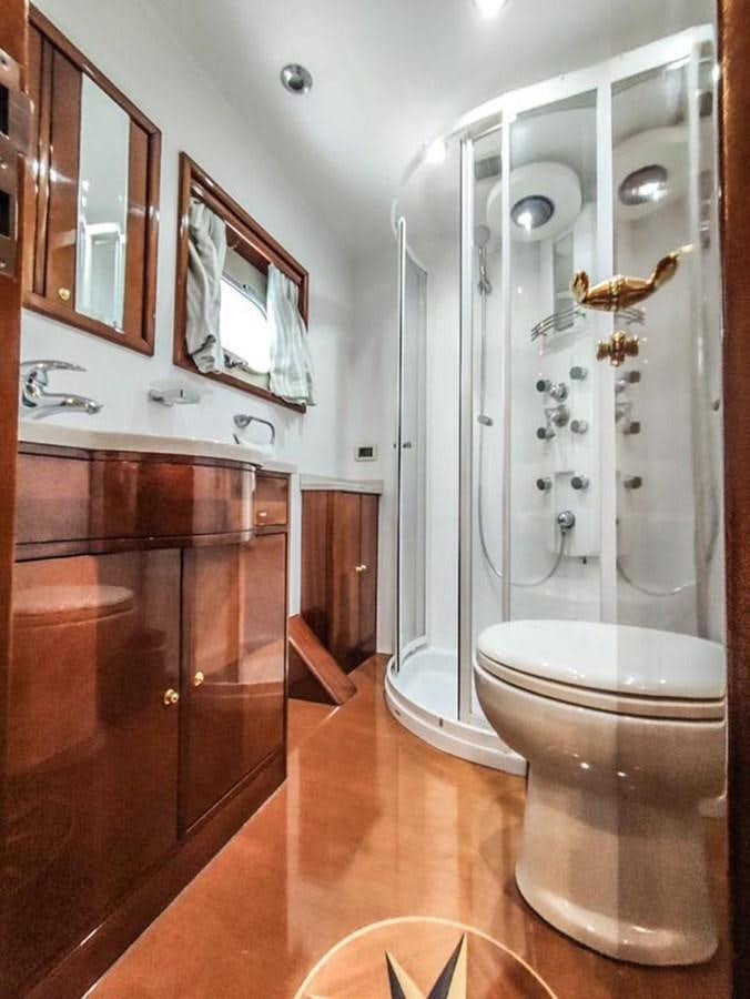 a bathroom with a glass shower aboard SEVEN YOU Yacht for Sale