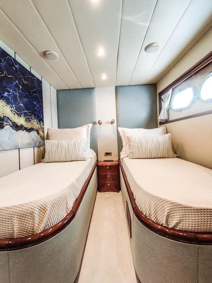 a couple of beds in a room aboard SEVEN YOU Yacht for Sale