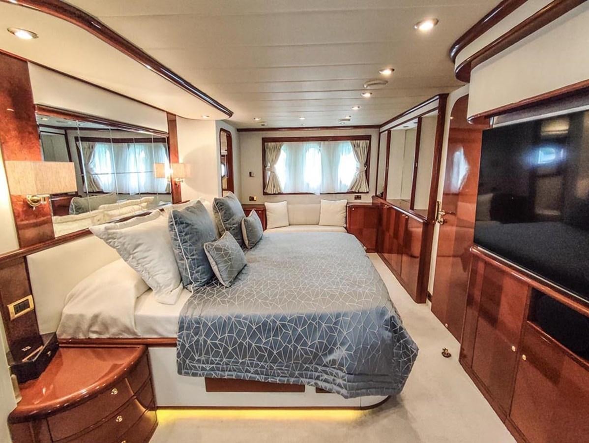 a large bedroom with a bed aboard SEVEN YOU Yacht for Sale