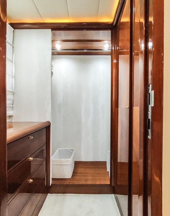a bathroom with a wood door aboard SEVEN YOU Yacht for Sale