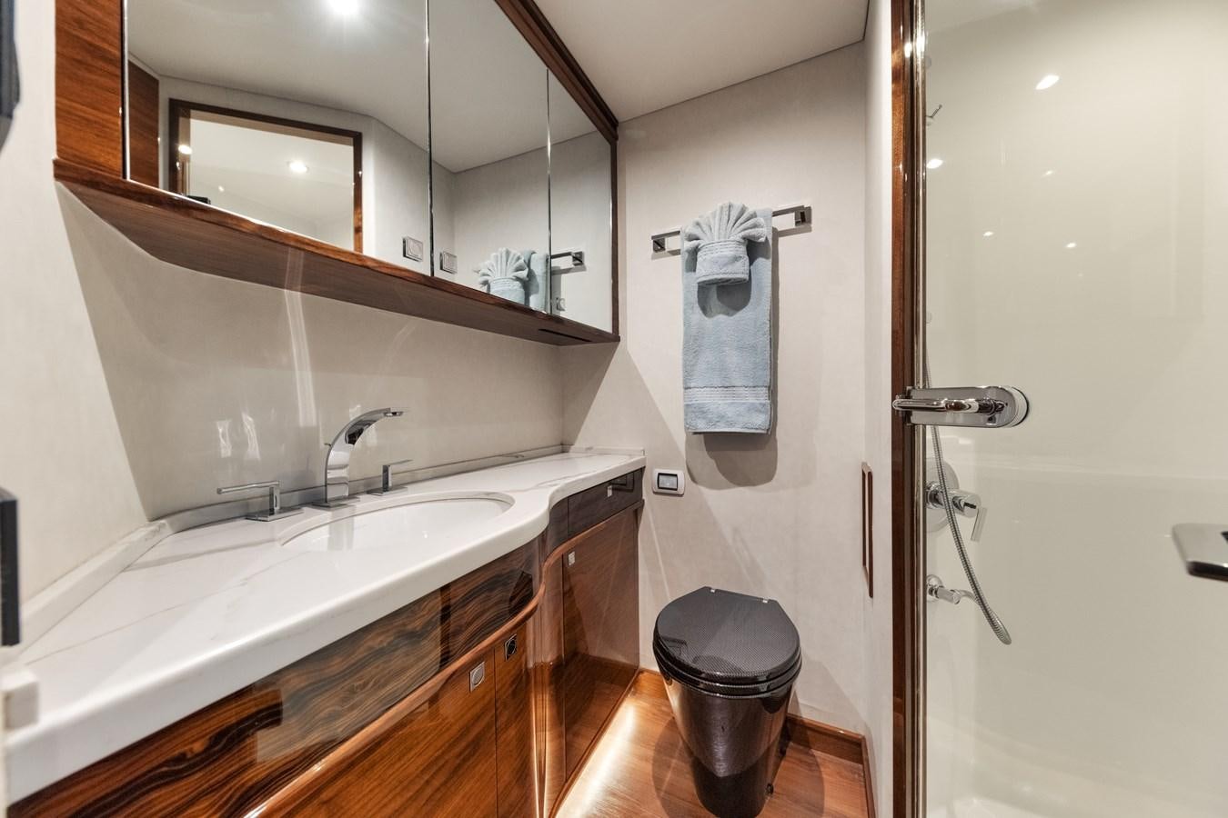 a bathroom with a sink and a mirror aboard JARUCO Yacht for Sale