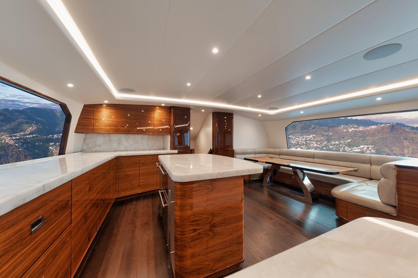 a room with wooden furniture aboard JARUCO Yacht for Sale