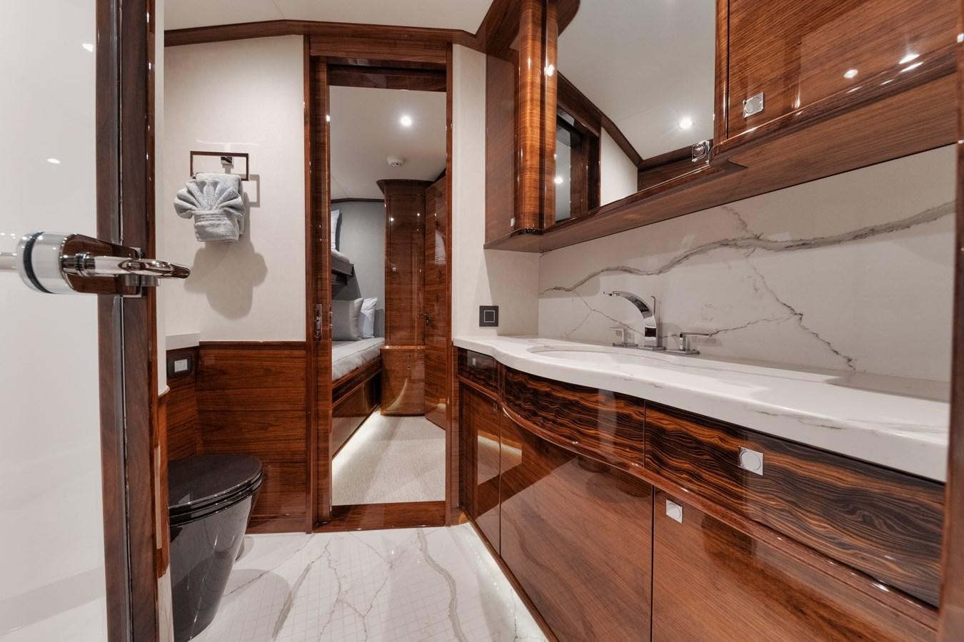 a bathroom with a tub sink and cabinets aboard JARUCO Yacht for Sale