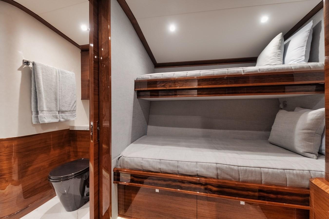 a bed with a wood frame aboard JARUCO Yacht for Sale